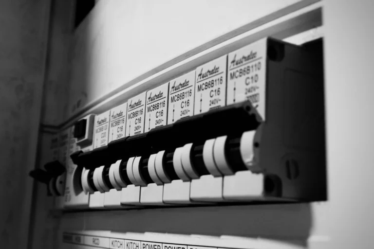 Close-up of a residential circuit breaker panel with multiple switches.